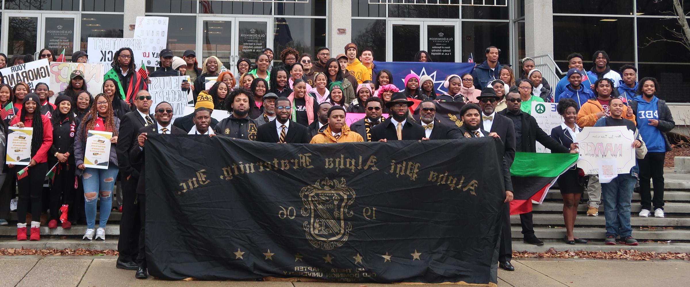 students at webb center with banner