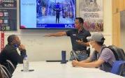 iFly employee gives orientation to Upward Bound youth.